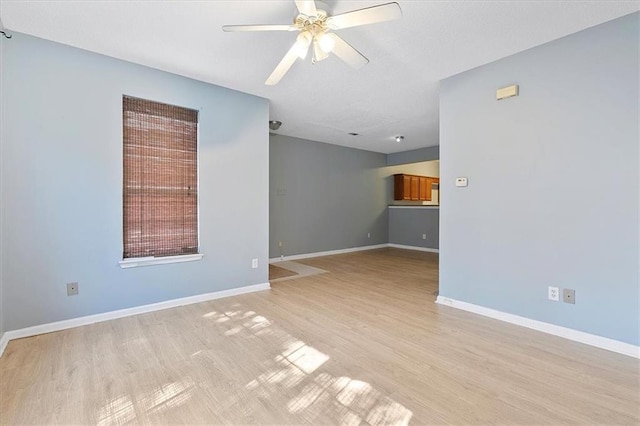 interior space with ceiling fan and light hardwood / wood-style flooring