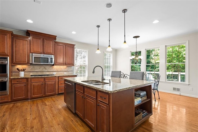 1215 Renaissance Ct SE, Mableton, GA 30126 - kitchen featuring stainless steel appliances, light wood-style floors, healthy amount of natural light, and recessed lighting