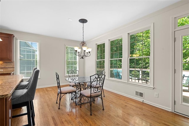 1215 Renaissance Ct SE, Mableton, GA 30126 - dining area with light wood finished floors and a chandelier