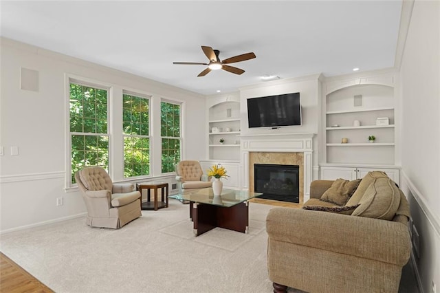 1215 Renaissance Ct SE, Mableton, GA 30126 - living area featuring a high end fireplace, a ceiling fan, and built in features