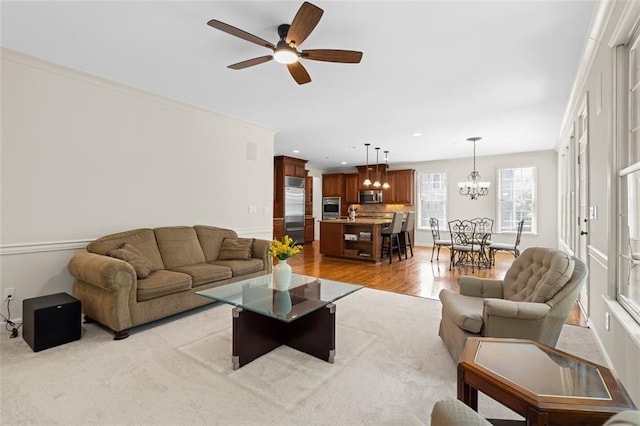 1215 Renaissance Ct SE, Mableton, GA 30126 - living room with ceiling fan, light wood finished floors, recessed lighting, and a chandelier