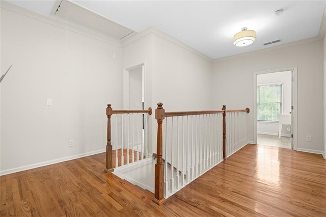 1215 Renaissance Ct SE, Mableton, GA 30126 - hall with an upstairs landing, attic access, wood finished floors, and ornamental molding