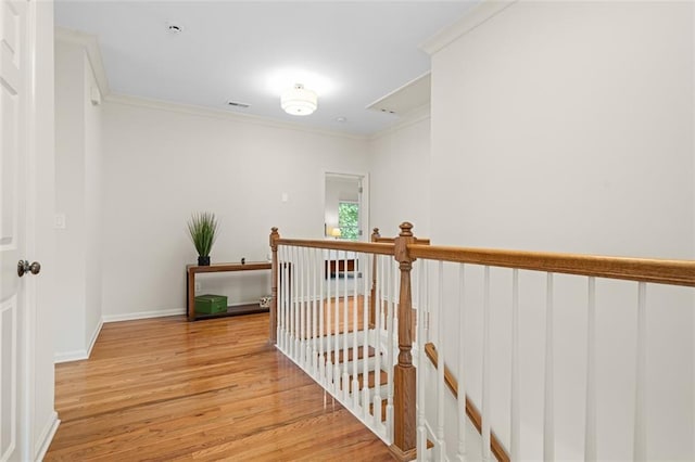 1215 Renaissance Ct SE, Mableton, GA 30126 - hall featuring an upstairs landing, light wood-type flooring, and ornamental molding