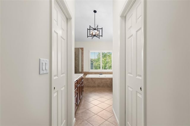 1215 Renaissance Ct SE, Mableton, GA 30126 - hallway with a chandelier and light tile patterned floors