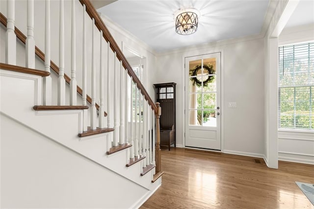 1215 Renaissance Ct SE, Mableton, GA 30126 - foyer featuring wood finished floors, stairs, and ornamental molding