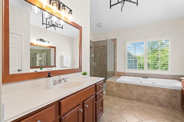 1215 Renaissance Ct SE, Mableton, GA 30126 - full bathroom with a chandelier, vanity, a garden tub, a stall shower, and tile patterned floors