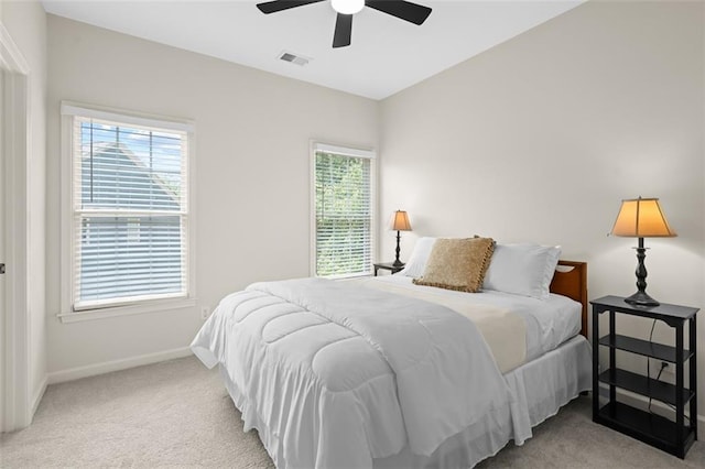 1215 Renaissance Ct SE, Mableton, GA 30126 - carpeted bedroom with multiple windows and ceiling fan