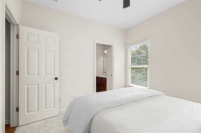 1215 Renaissance Ct SE, Mableton, GA 30126 - carpeted bedroom with ensuite bath and ceiling fan