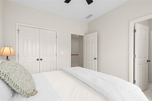 1215 Renaissance Ct SE, Mableton, GA 30126 - carpeted bedroom with a closet and ceiling fan