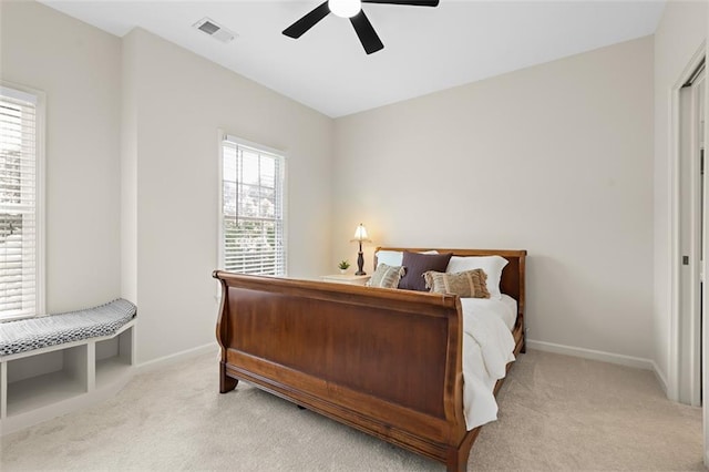 1215 Renaissance Ct SE, Mableton, GA 30126 - bedroom with light carpet, multiple windows, and a ceiling fan