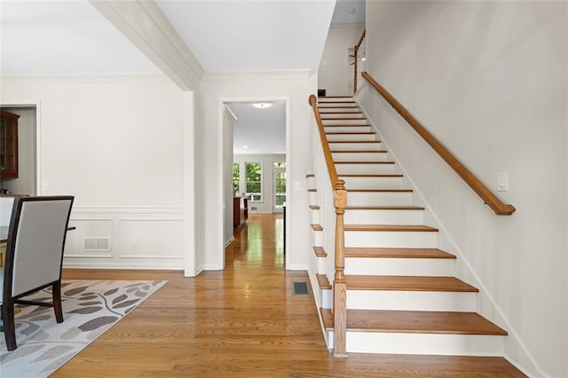 1215 Renaissance Ct SE, Mableton, GA 30126 - stairway featuring crown molding and wood finished floors