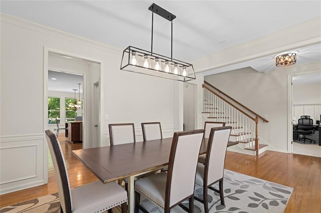 1215 Renaissance Ct SE, Mableton, GA 30126 - dining room featuring wood finished floors, stairs, and a chandelier