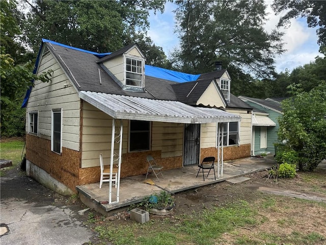 back of house with a patio