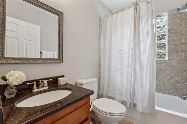183 Whitefoord Ave NE, Atlanta, GA 30307 - full bath featuring plenty of natural light, toilet, shower / bath combination with curtain, and vanity