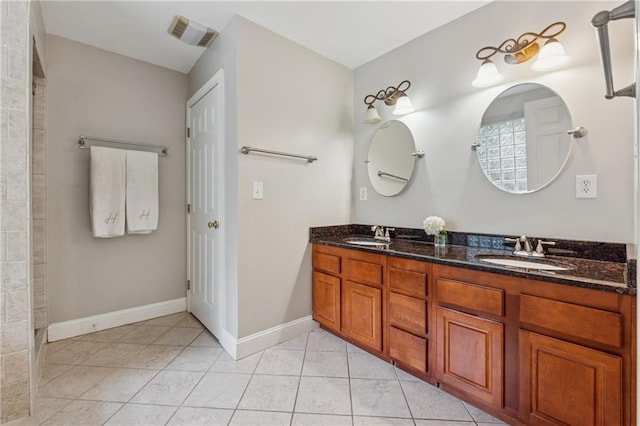 183 Whitefoord Ave NE, Atlanta, GA 30307 - full bath featuring baseboards, double vanity, tile patterned floors, and a tile shower