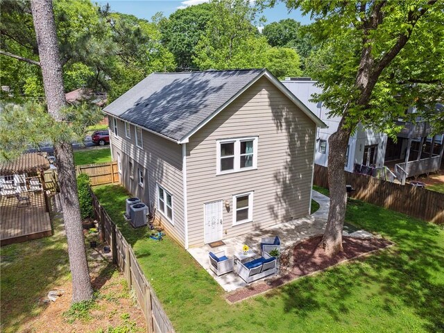 183 Whitefoord Ave NE, Atlanta, GA 30307 - back of house with a patio area, a shingled roof, central air condition unit, and an outdoor living space