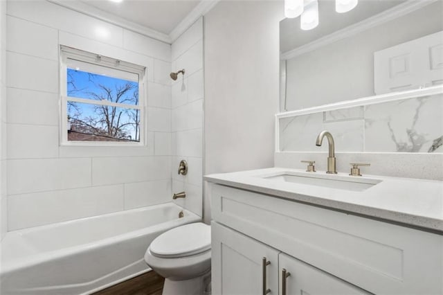 full bath featuring vanity, wood finished floors, shower / tub combination, crown molding, and toilet