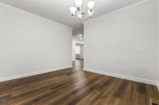 unfurnished dining area featuring baseboards, visible vents, an inviting chandelier, dark wood-style flooring, and ornamental molding