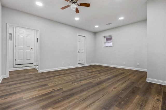 unfurnished room with visible vents, baseboards, recessed lighting, ceiling fan, and dark wood-type flooring