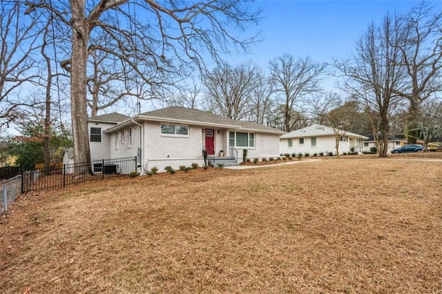 single story home featuring brick siding, a front lawn, and fence