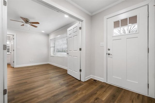 entrance foyer with baseboards, crown molding, a ceiling fan, and dark wood-style flooring