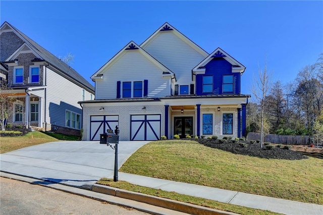 craftsman-style house with french doors, a front lawn, and a garage