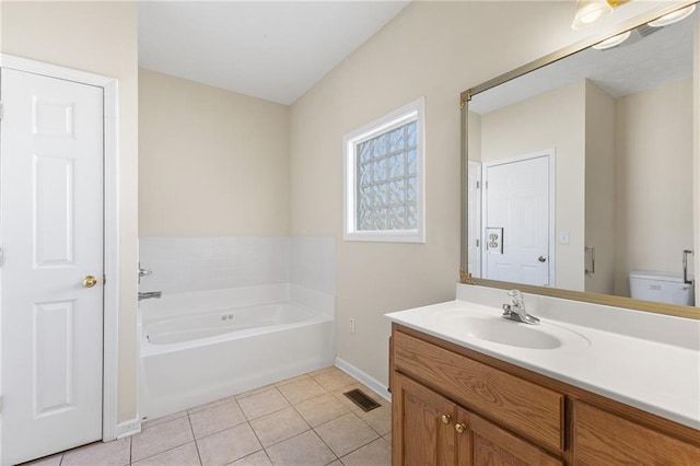 full bathroom featuring visible vents, baseboards, a garden tub, tile patterned flooring, and vanity