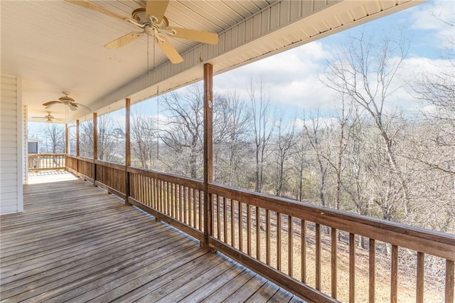 wooden terrace featuring a ceiling fan