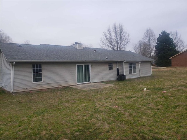 back of property featuring a yard, a patio area, and central air condition unit