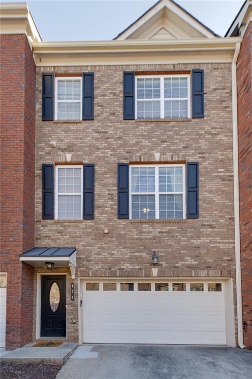 multi unit property featuring a garage