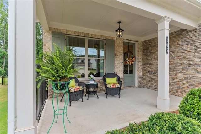 view of patio featuring a porch