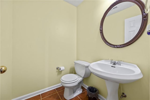 bathroom featuring tile patterned floors and toilet