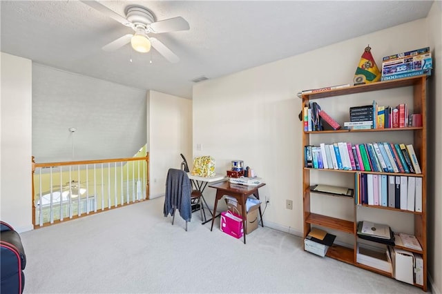 misc room featuring ceiling fan and light carpet