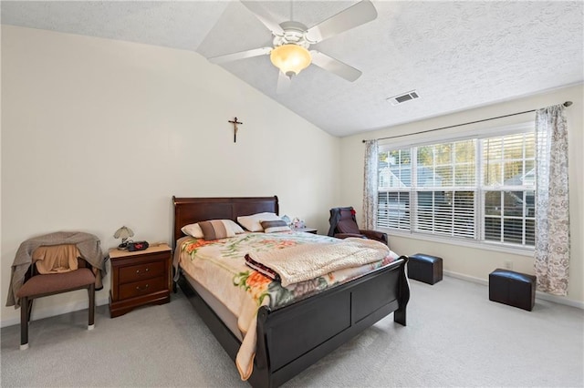 carpeted bedroom featuring a textured ceiling, ceiling fan, and lofted ceiling