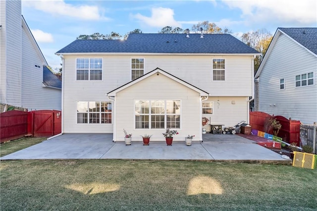 rear view of property with a patio area and a yard