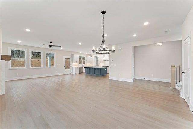 kitchen featuring light stone countertops, sink, dark hardwood / wood-style floors, white cabinets, and tasteful backsplash