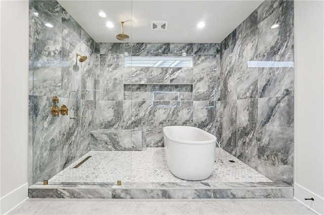 bathroom featuring shower with separate bathtub and tile walls