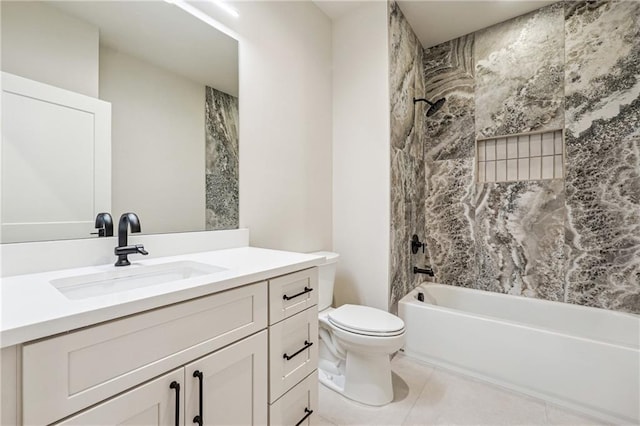 full bathroom featuring tile patterned floors, vanity, toilet, and tiled shower / bath combo