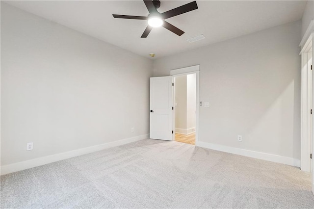 unfurnished bedroom with light carpet and ceiling fan