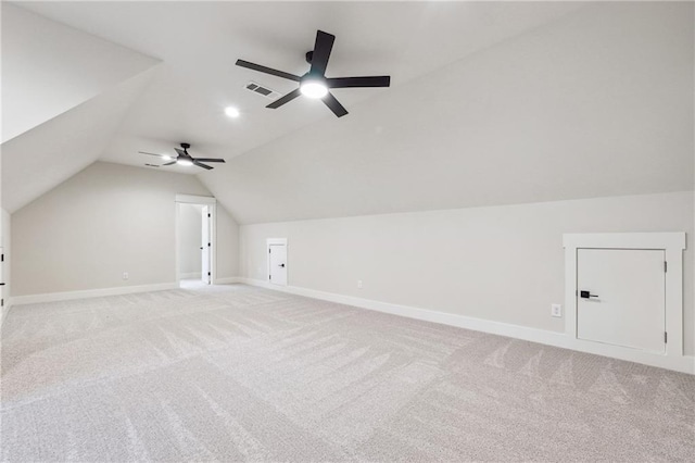 bonus room with lofted ceiling, light colored carpet, and ceiling fan