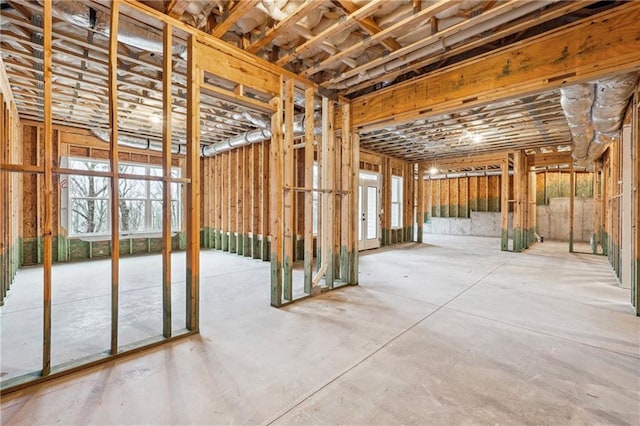 miscellaneous room with concrete flooring and a healthy amount of sunlight