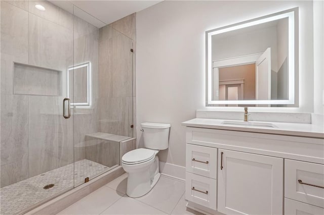 bathroom with vanity, toilet, an enclosed shower, and tile patterned flooring