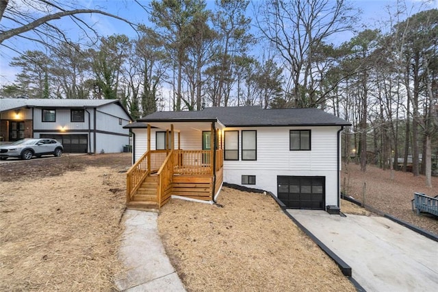 view of front of home featuring a garage and covered porch