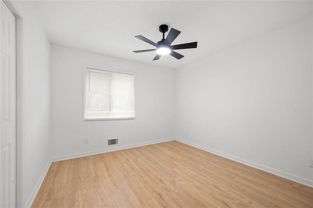 spare room with ceiling fan and light hardwood / wood-style flooring