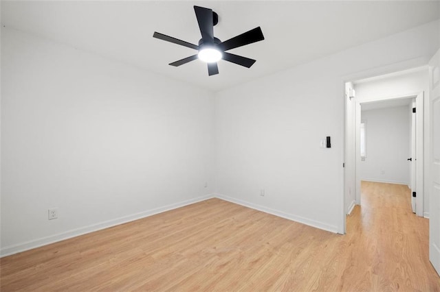 empty room with ceiling fan and light wood-type flooring