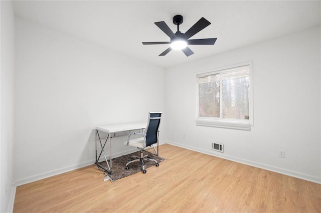 home office featuring ceiling fan and light hardwood / wood-style floors