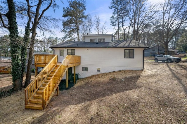 back of property featuring a wooden deck and central air condition unit