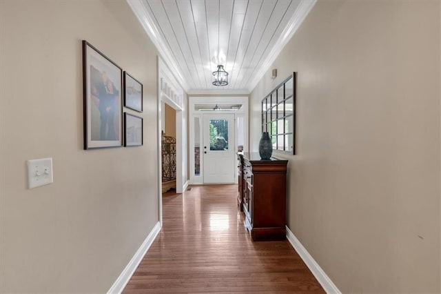 87 Washington Blvd, Dallas, GA 30132 - doorway to outside with ornamental molding, dark wood-type flooring, baseboards, and a chandelier