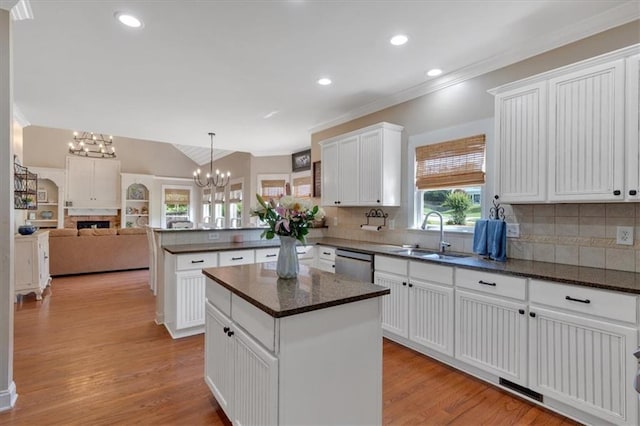 87 Washington Blvd, Dallas, GA 30132 - kitchen with a sink, a peninsula, ornamental molding, decorative backsplash, and open floor plan