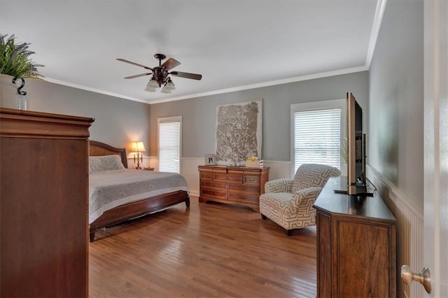 87 Washington Blvd, Dallas, GA 30132 - bedroom featuring wainscoting, dark wood finished floors, multiple windows, ornamental molding, and a ceiling fan
